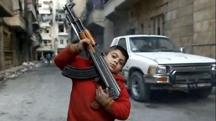  'A child holding an assault rifle'