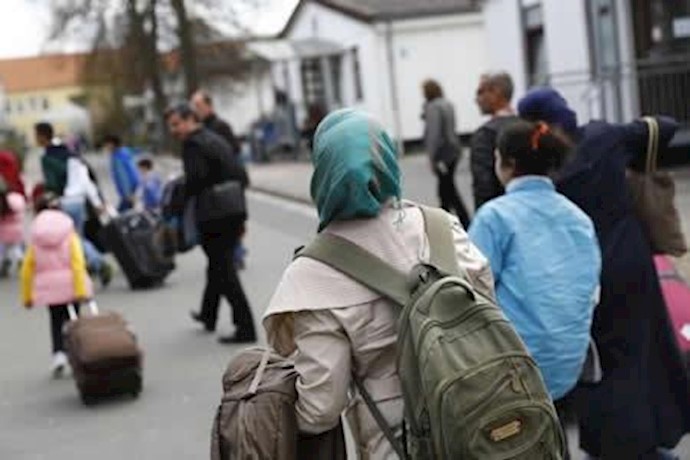 Defiant Merkel says refugees not taking away benefits from Germans