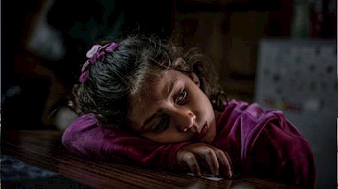  'An 8 year-old refugee girl from the Syria, in an open camp run by volunteers outside of Mytilini, Lesvos, Greece'