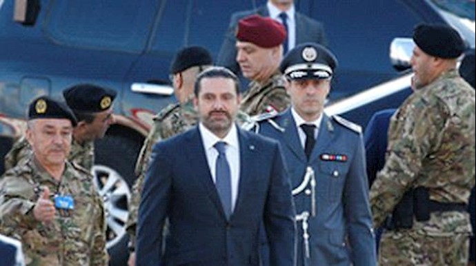 Hariri, back in Beirut, attends national day parade