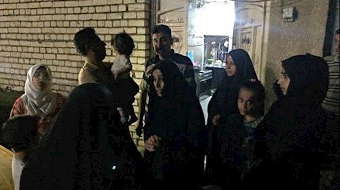  'People stand in the street after feeling aftershocks from an earthquake in Baghdad, Iraq.'