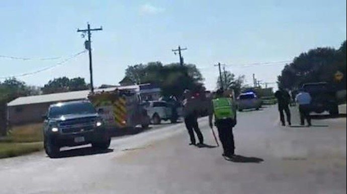  'Police and first responders block a road near a church in Sutherland Springs, Texas on November 5, 2017'