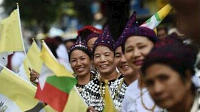  'Kachin people in traditional dress were among the crowds hoping to catch a glimpse of Pope Francis when he arrives in Myanmar'