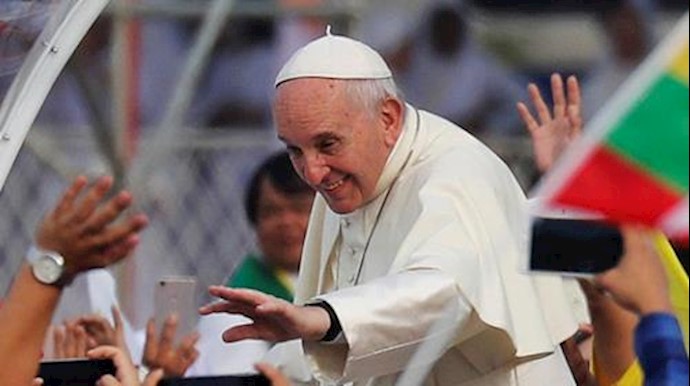  'Pope Francis waves to Catholic faithful as he arrives to lead a mass at Kyite Ka San Football Stadium in Yangon, Myanmar November 29, 2017'