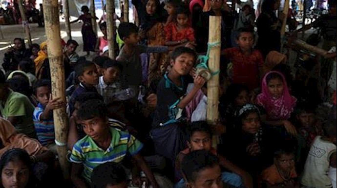  'Rohingya refugees wait at a relief centre after crossing the Bangladesh-Myanmar border in the Teknaf area, Bangladesh, November 23, 2017'