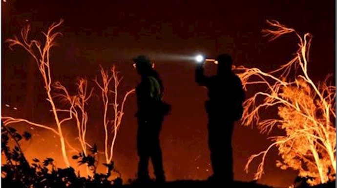 Largest California fire not expected to spread as winds subside