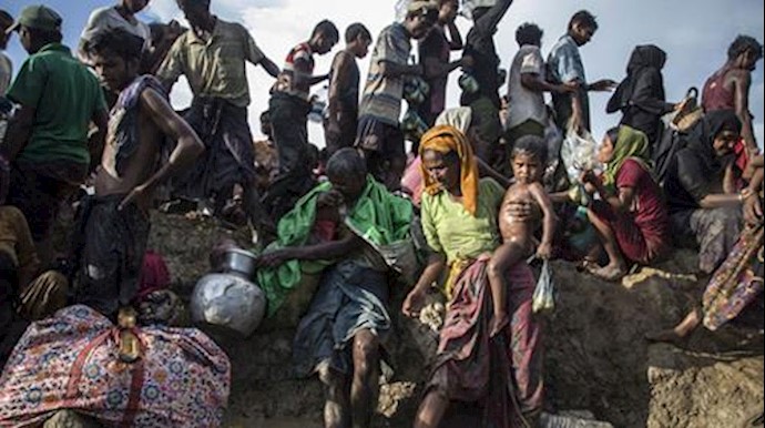  'Rohingya refugees including women and children cross from Myanmar into Bangladesh at Palong Khali in Cox’s Bazar district'