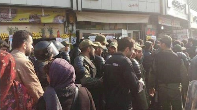  'Iranians protested in central Tehran as security forces heavily deployed.'