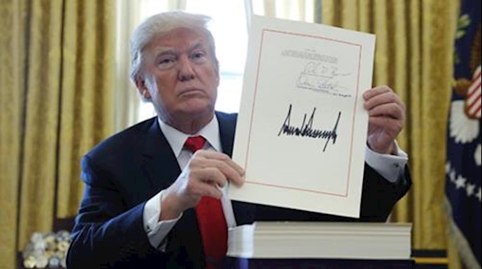 Trump signs tax, government spending bills into law