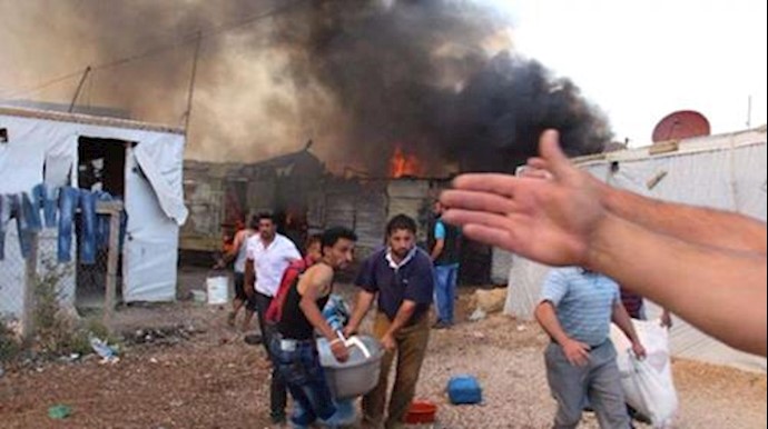  'Fire engulfs an unofficial refugee camp in Lebanons eastern Beqaa Valley on June 1, 2015'