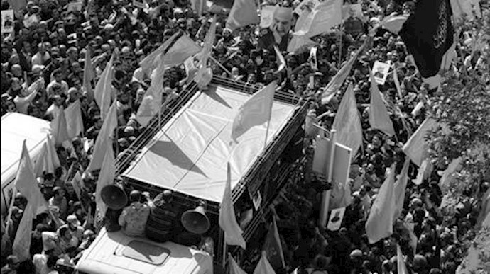 'Iranian men carry portraits of Iran’s Revolutionary Guards Brigadier General Hossein Hamedani during his funeral in Tehran on October 11, 2015.'