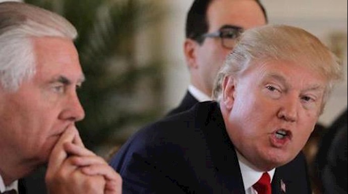  'U.S. President Donald Trump speaks next to Secretary of State Rex Tillerson '