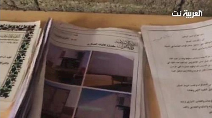  'Documents and photos belonging to ISIS found by Iraqi forces. (Supplied)'