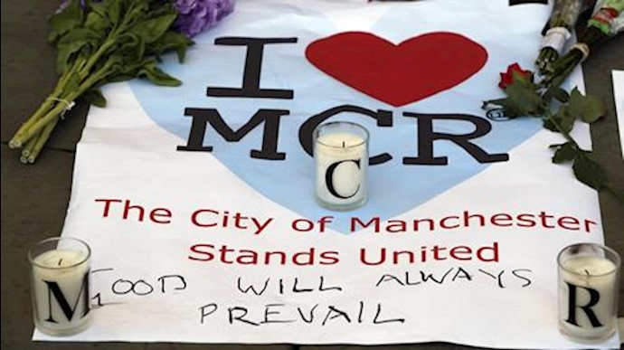 Britain cuts terrorism threat level after more arrests