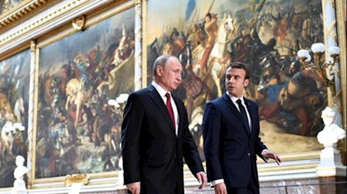 After talks, France’s Macron hits out at Russian media, Putin denies hacking