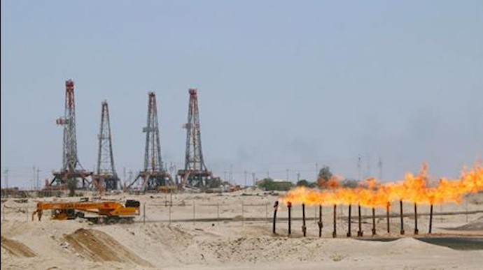  'Flames emerge from a pipeline at Rumaila oilfield in Basra, Iraq, May 11, 2017'