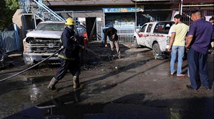  'Iraqi security forces gather at the site of a bomb attack in the city of Kerbala, Iraq '