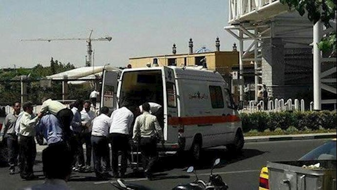  'Emergency services outside the parliament building in Tehran.'