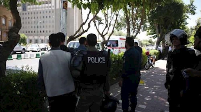  'Police stand near the parliaments building during a gunmen attack in central Tehran, Iran, June 7, 2017. '