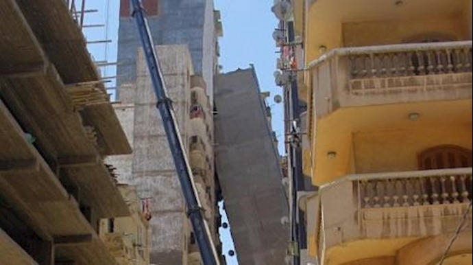 Apartment block in Egypt tilts across street