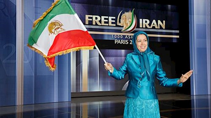  'Maryam Rajavi waving the flag of Iran at the Grand Gathering of the Iranian Resistance in Paris'