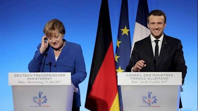  'German Chancellor Angela Merkel and French President Emmanuel Macron attend a joint news conference at the Elysee Palace in Paris on Thursday'