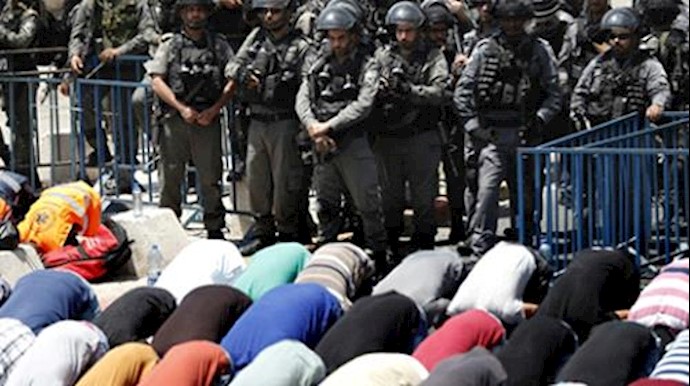 Palestinians pray outside holy site after Israeli restrictions