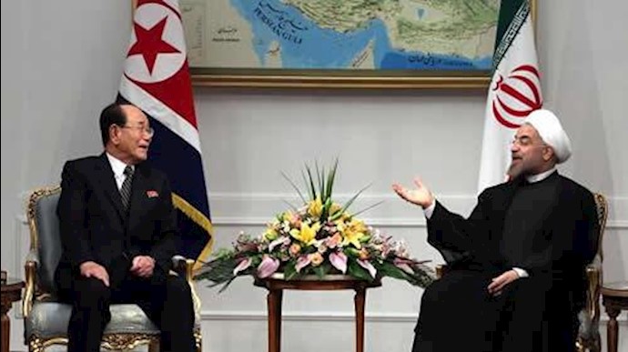 'Irans President Hassan Rouhani meets with North Koreas ceremonial head of state, Kim Yong Nam in 2013.'