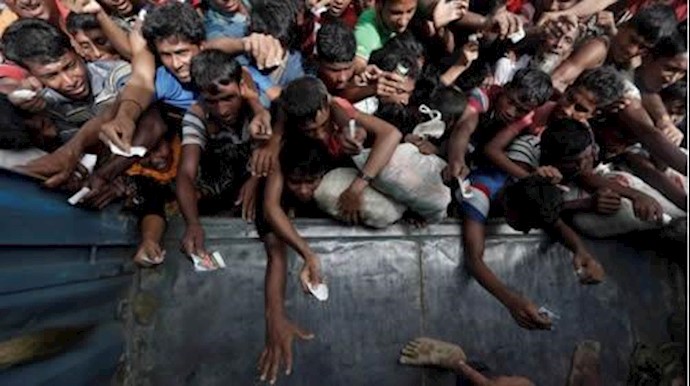  'Rohingya refugees wait to receive aid in Coxs Bazar, Bangladesh September 24, 2017.'