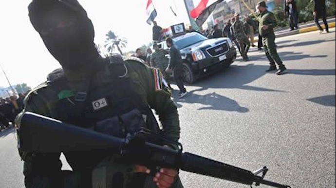  'A Shiite militia fighter stands guard in the northern Iraqi city of Samarra on January 17, 2017, following an attack by the Islamic State group'