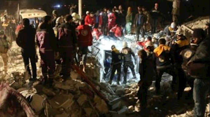  'Syrian emergency personnel search for victims following an explosion in a rebel-held area of the northwestern city of Idlib on January 7, 2018'