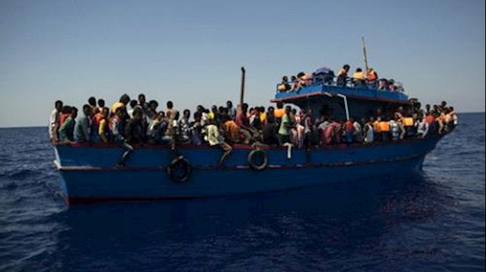  'Migrants wait to be rescued in the Mediterranean Sea close to the Libyan coast on August 2, 2017'