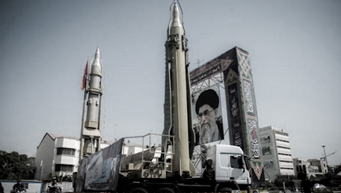  'A display featuring missiles and a portrait of Iran's Supreme Leader Ali Khamenei '
