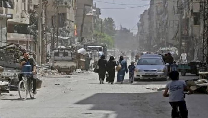  'People in the streets of Douma during a press visit organized by Assad regime'