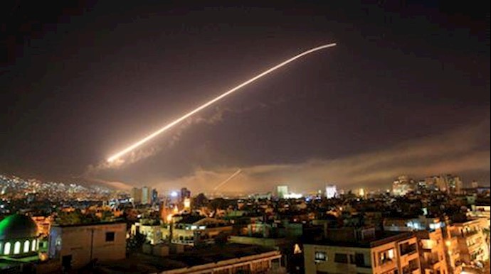  'The Damascus sky lights up missile fire as the US launches an attack on Syria on April 14, 2018'
