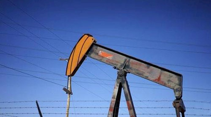  'FILE PHOTO An oil well pump jack is seen at an oil field supply yard near Denver, Colorado February 2, 2015.'