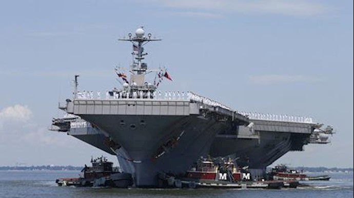  'Sailors man the rails as the nuclear powered aircraft carrier Harry S. Truman arrives at Naval Station Norfolk, USA'